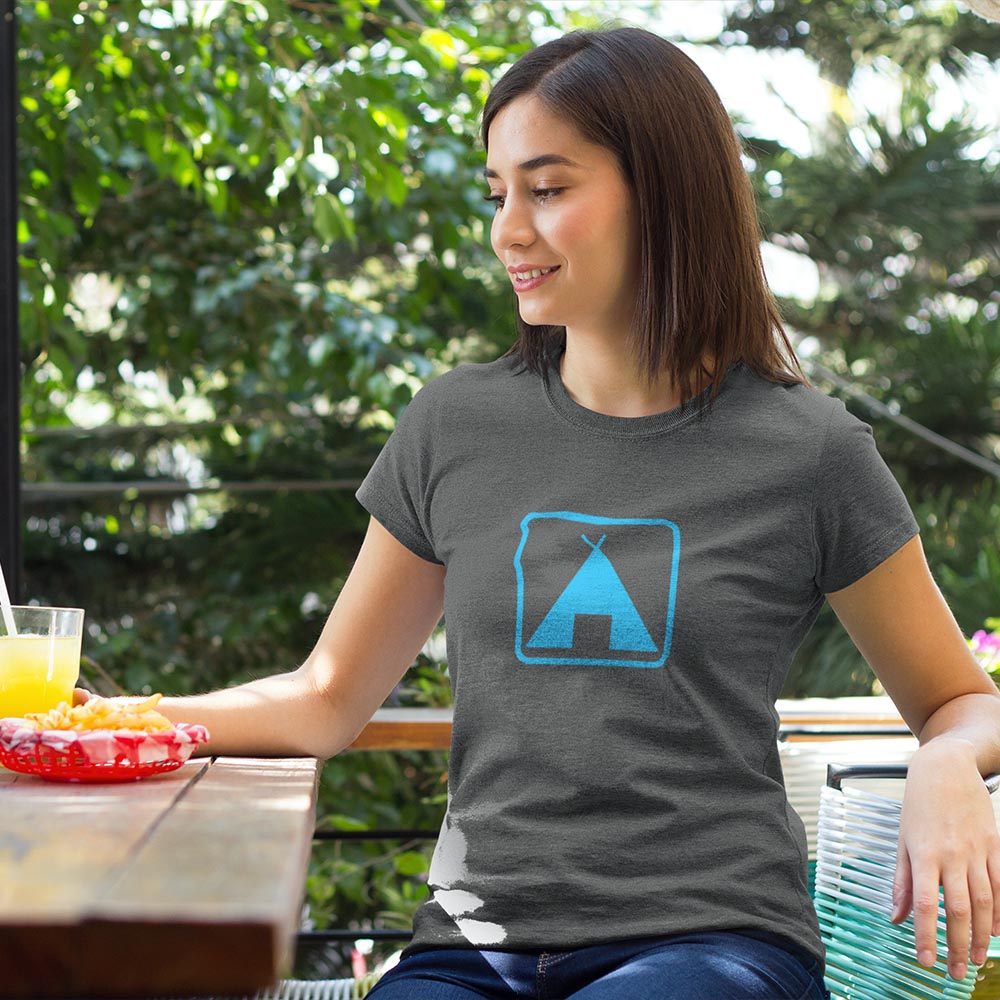 woman outside wearing camping sign shirt